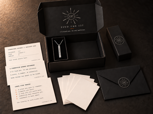 Find the 137 single necklace gift set: vertical silver bar pendant, black gift box and envelope, three story cards and five blank drawing cards. Illustrative product image.